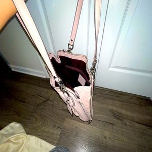 Light purple leather bag with silver hardware.
